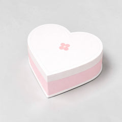 Stockka white heart-shaped gift box with pink flower detail and pink base, made of rigid cardboard.