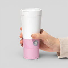 Stockka white and pink stainless steel thermal tumbler with a secure lid and a floral logo.