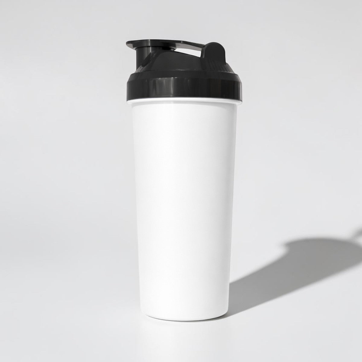 Stockka white 450ml plastic shaker bottle with black flip-top lid for protein shakes and pre-workout drinks.