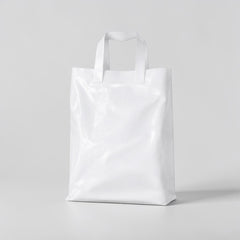 Stockka white plastic shopping bag with soft loop handles, 30x40cm, made from HDPE.