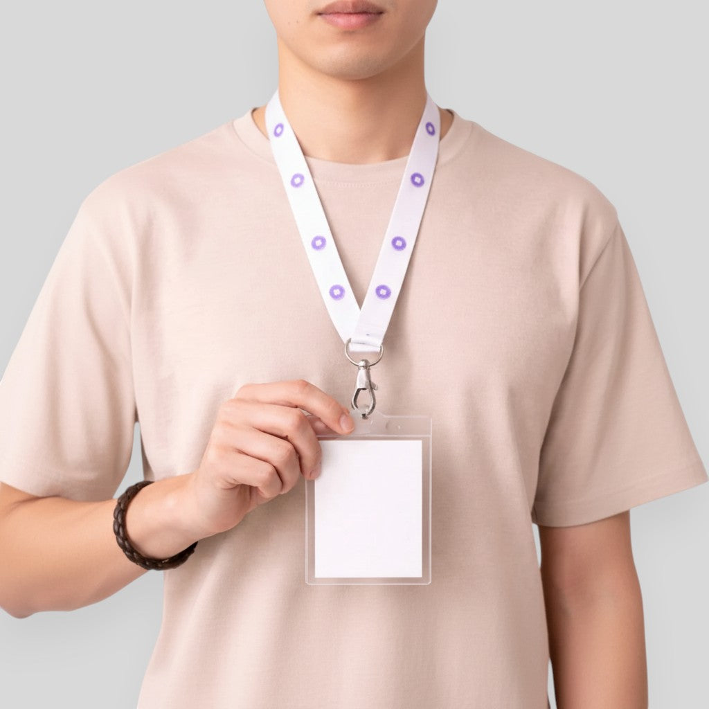 Stockka white polyester lanyard with purple circle pattern and metal clip holding a clear ID card holder.