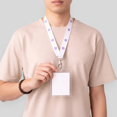Stockka white polyester lanyard with purple circle pattern and metal clip holding a clear ID card holder.