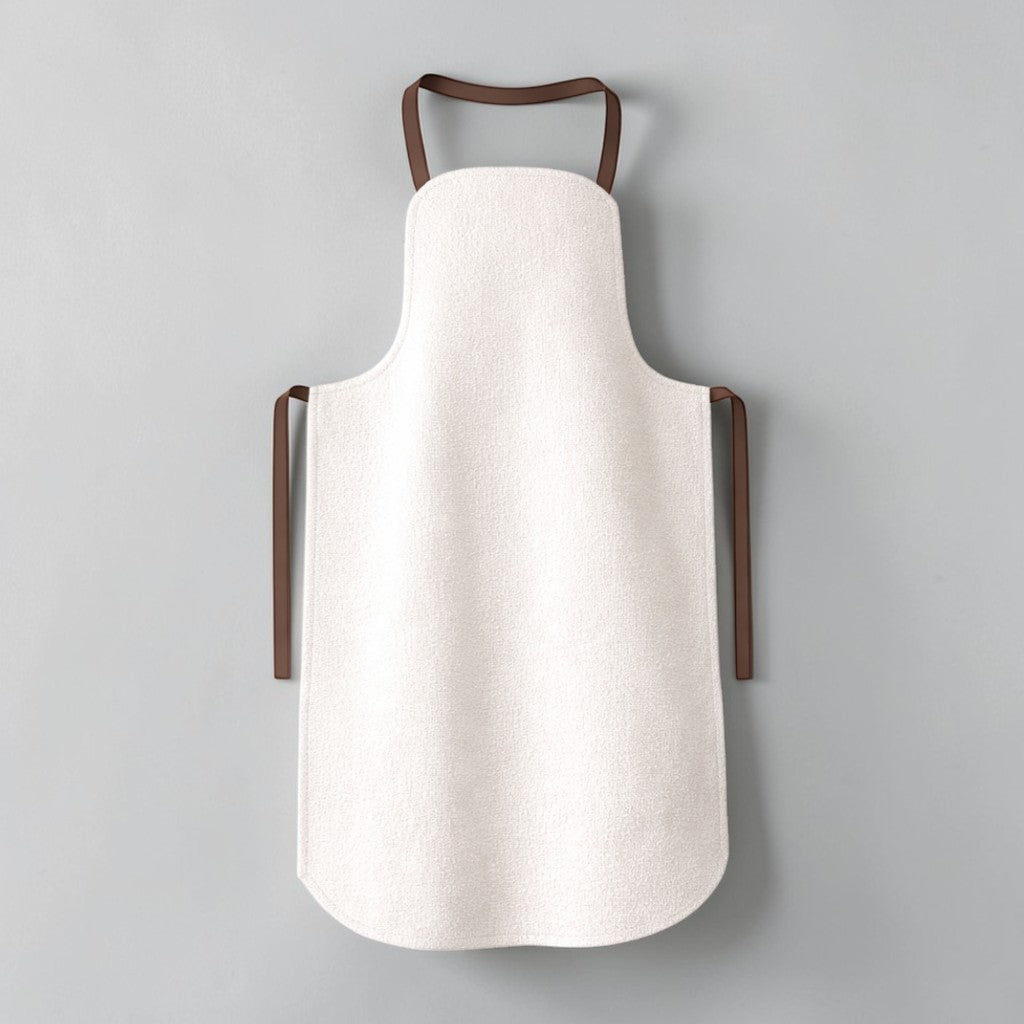 Stockka modern full-length apron in white polyester twill with rounded hem and dark brown straps.