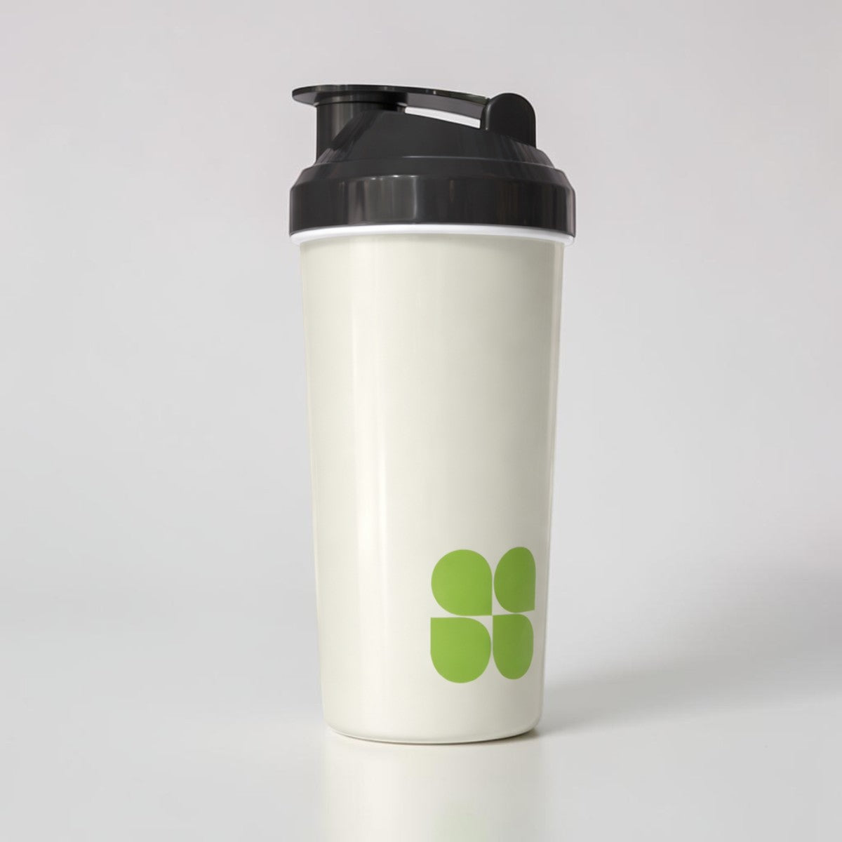 Stockka white plastic protein shaker with black lid and green logo, 450ml, BPA-free, leak-proof, dishwasher safe.