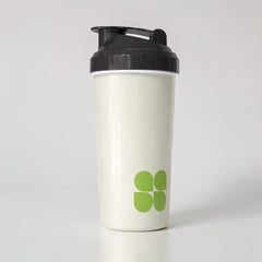 Stockka white plastic protein shaker with black lid and green logo, 450ml, BPA-free, leak-proof, dishwasher safe.