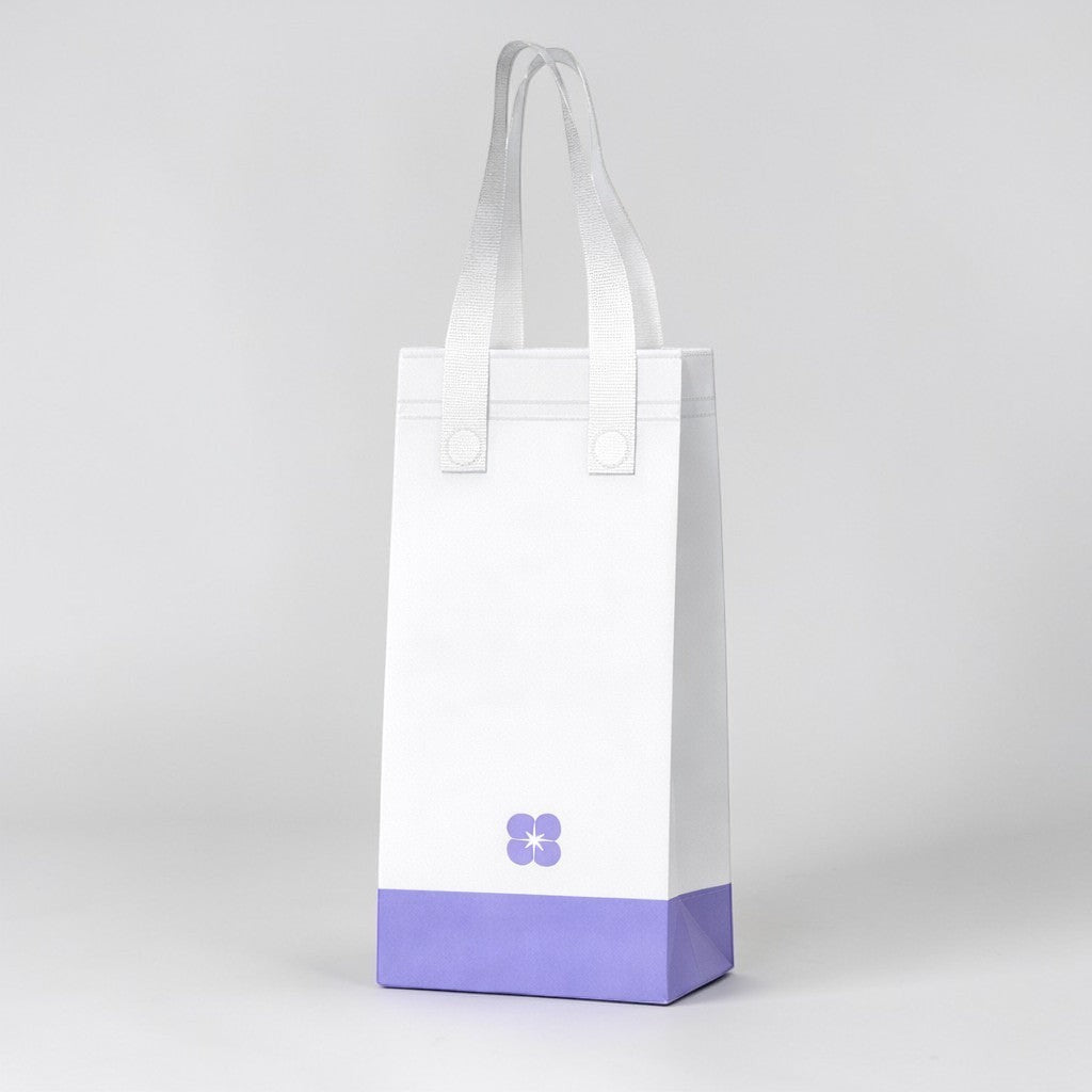 Stockka white non-woven tote bag with a purple base and a small purple flower logo, ideal for carrying cups.