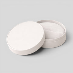 Stockka white round jewelry box with removable lid, made of matte finish rigid cardboard, ideal for rings, earrings, or accessories.