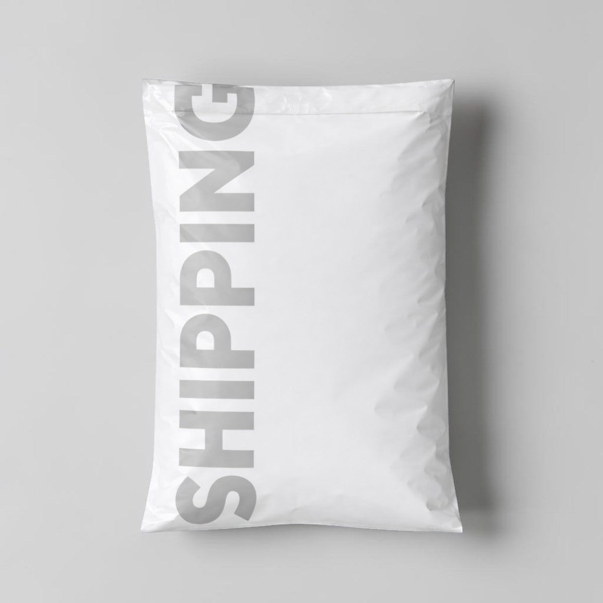Stockka white vertical shipping mailer bag with self-adhesive strip, made of durable LDPE plastic.