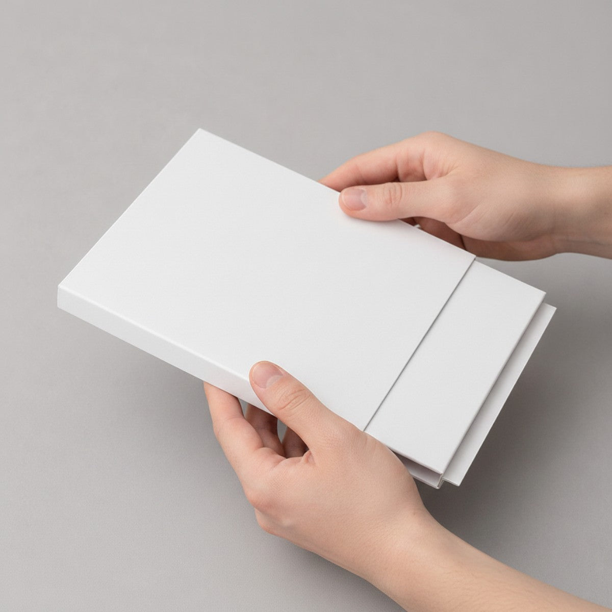 Stockka white matte cardboard slider box packaging, ideal for gift vouchers, luxury tickets, or premium promotional items.