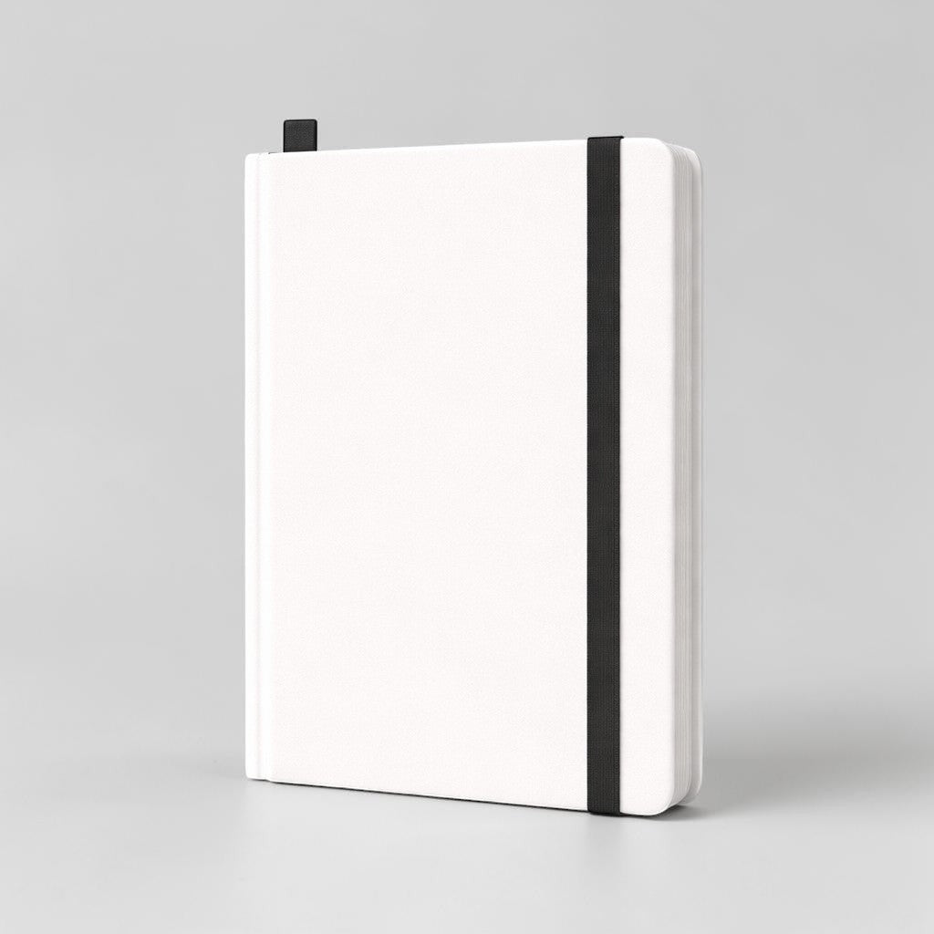 Stockka white soft cover notebook with elastic closure and ribbon bookmark, 80 lined pages.
