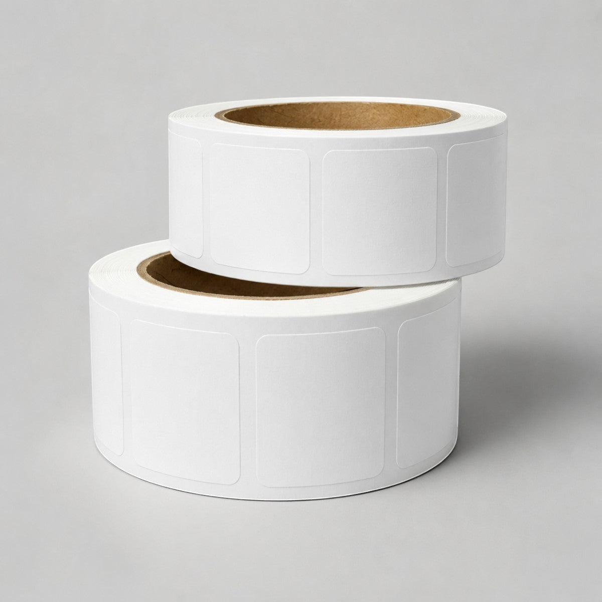 Stockka white square labels with rounded corners on a roll, ideal for product labeling, packaging, and shipping.