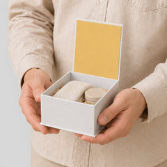 Stockka white square magnetic gift box with yellow interior, holding small items. Perfect for luxury packaging.