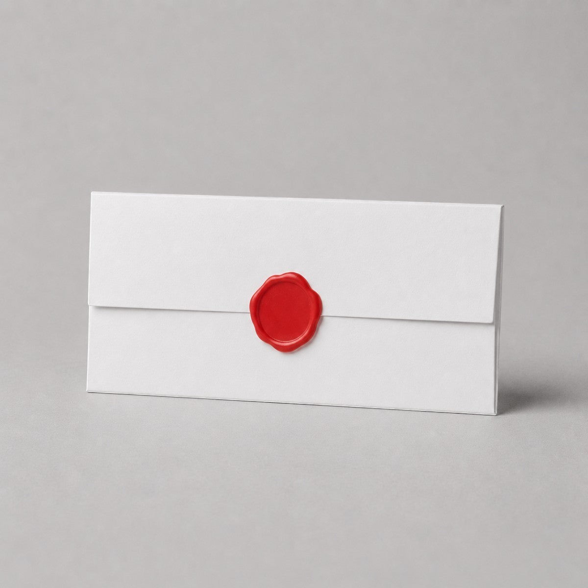 Stockka elegant white 250gsm uncoated paper envelope with red wax seal detail. Ideal for formal invitations and official documents.
