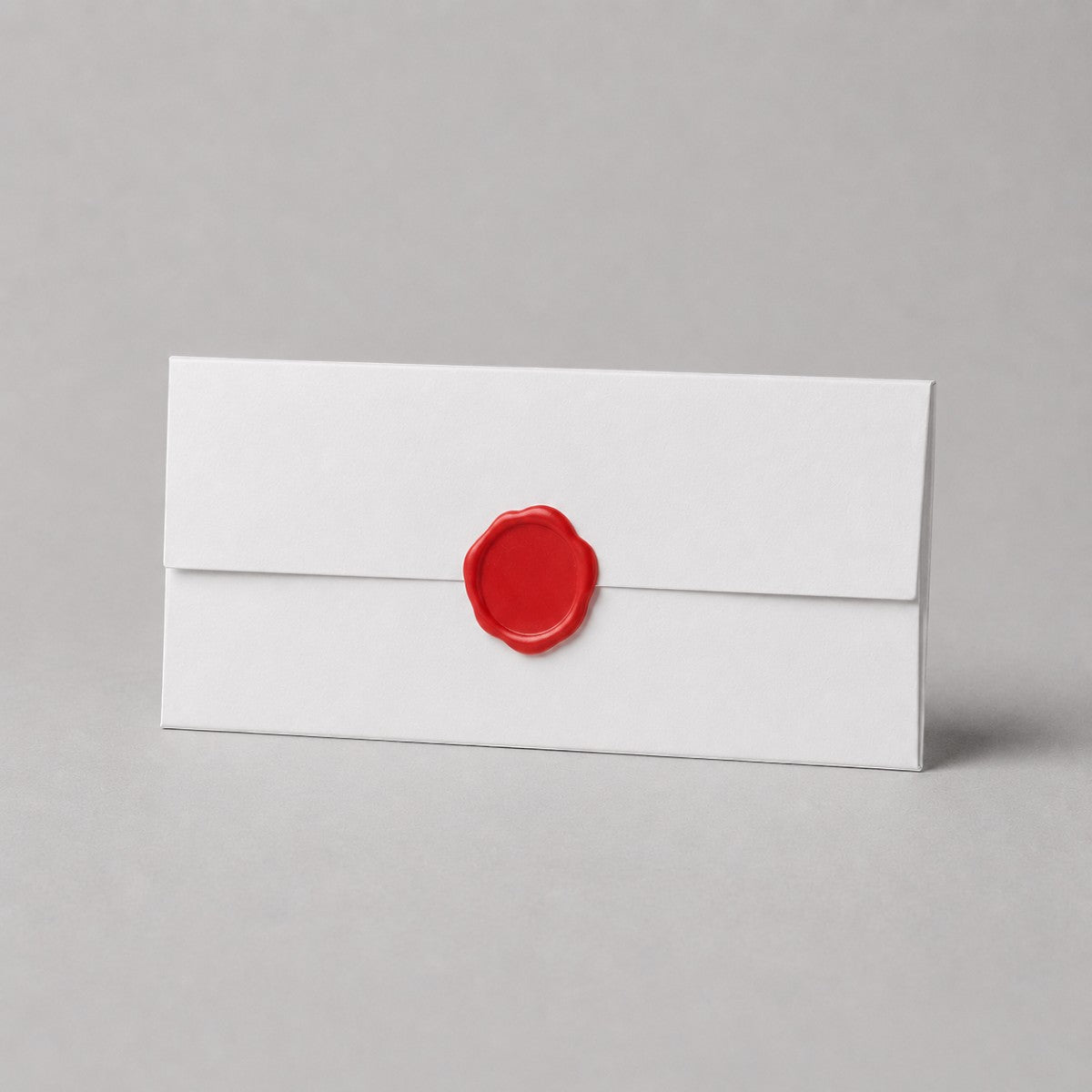 Stockka elegant white 250gsm uncoated paper envelope with red wax seal detail. Ideal for formal invitations and official documents.