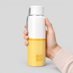 Stockka white and yellow BPA-free plastic water bottle with screw-top lid and hanging handle.