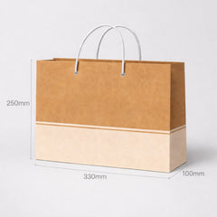 Stockka wide kraft paper gift bag with white rope handles, perfect for premium packaging.