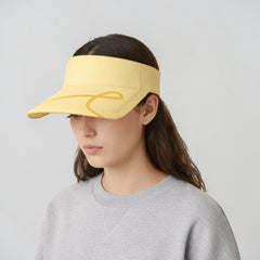 Stockka yellow cotton tennis visor with a subtle yellow graphic detail. Adjustable and lightweight.