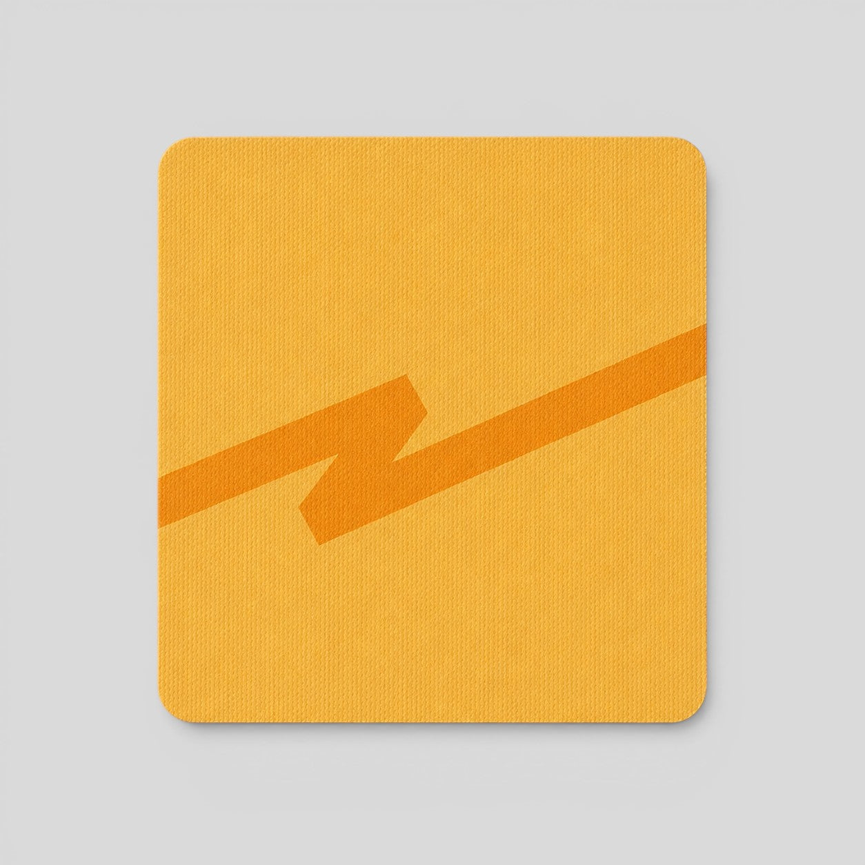 Stockka modern yellow square mousepad with orange zigzag design, fabric texture.
